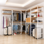Corner open wardrobe system with white powder-coated frame and wood-effect melamine shelves in dressing room